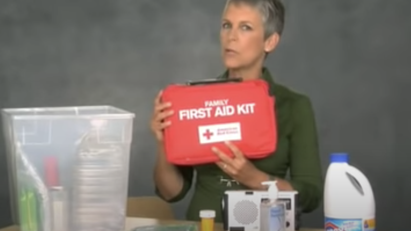 Woman with first aid kit